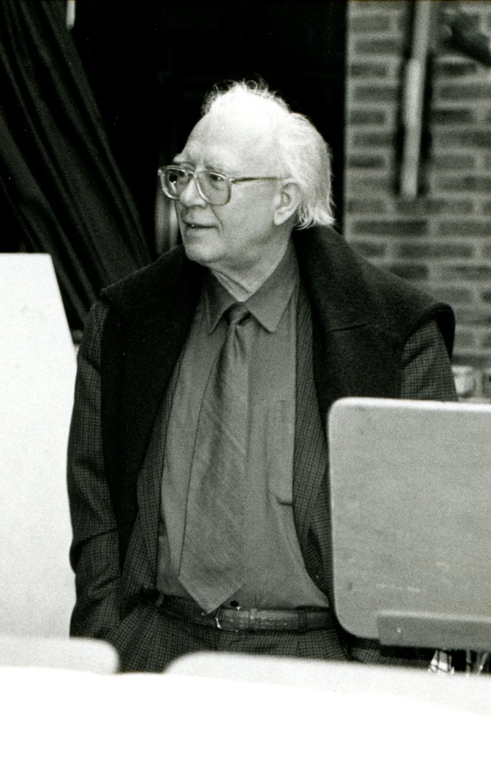Portrait photograph: Bertold Hummel wearing glasses during a photo shoot, December 1993.
