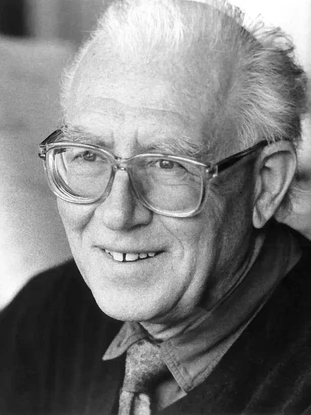 Portrait photograph: Bertold Hummel, smiling, wearing glasses, 1993.