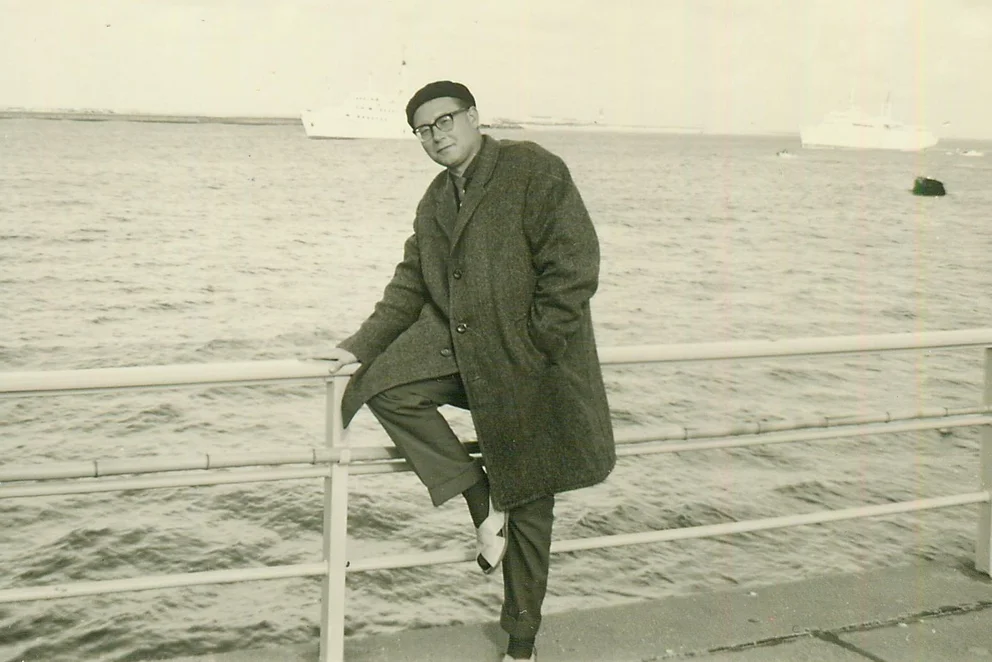 Bertold Hummel on a harbour wall on Heligoland, with ships in the background, 29 August 1962.
